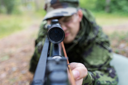 Hunter Laying Down to Stalk His Target in Idaho